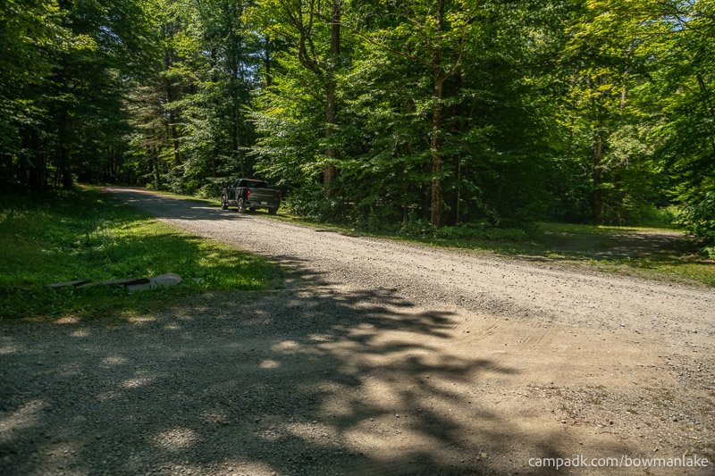Campsite Photo of Site 105 at Bowman Lake State Park, New York - View Down Road from Campsite