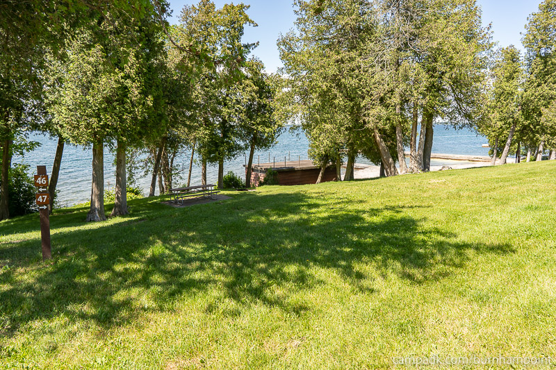 Campsite Photo of Site 47 at Burnham Point State Park, New York - Looking at Site from Road Sign Visible
