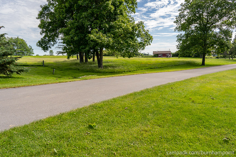 Campsite Photo of Site 8 at Burnham Point State Park, New York - Looking Back Towards Road