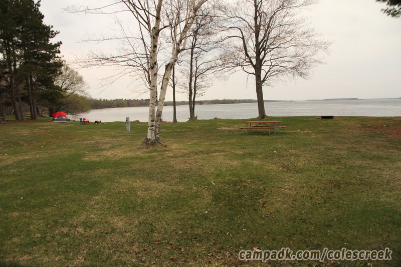 Campsite Photo of Site 83 at Coles Creek State Park, New York - Looking at Site from Road Sign Visible