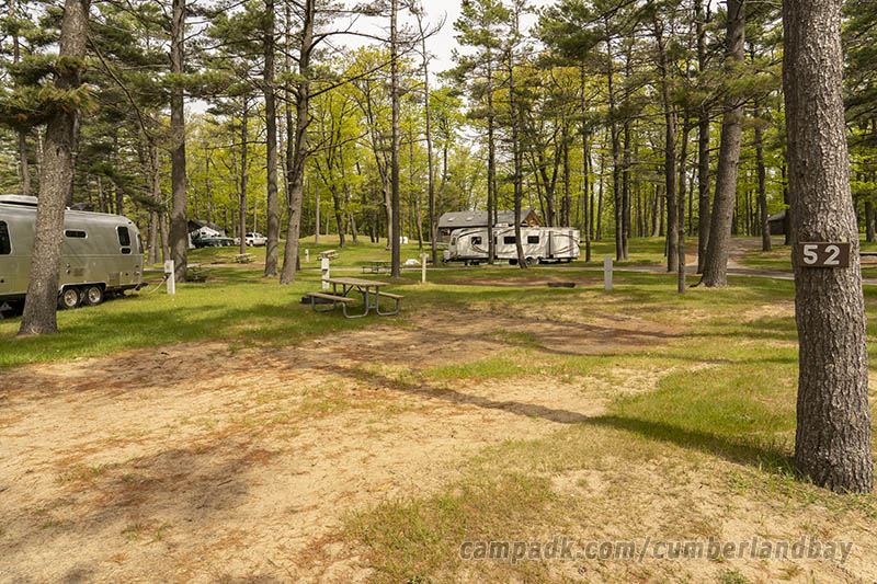 Campsite Photo of Site 52 at Cumberland Bay State Park, New York - Looking at Site from Road Sign Visible