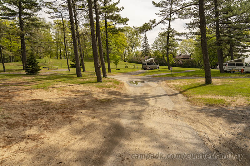 Campsite Photo of Site 52 at Cumberland Bay State Park, New York - View Down Road from Campsite