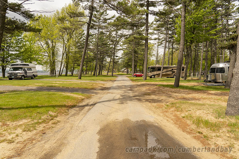 Campsite Photo of Site 52 at Cumberland Bay State Park, New York - View Down Road from Campsite