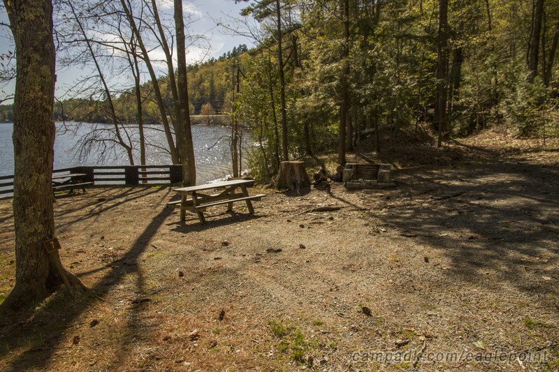 Campsite Photo of Site 7 at Eagle Point Campground, New York - Looking at Site from Road Sign Visible