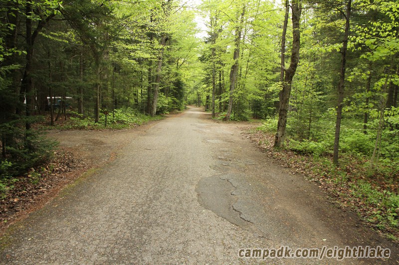 Campsite Photo of Site 25 at Eighth Lake Campground, New York - View Down Road From Campsite