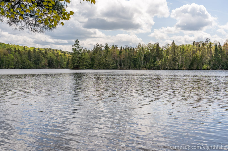 Campsite Photo of Site 112 at Eighth Lake Campground, New York - View from Shoreline