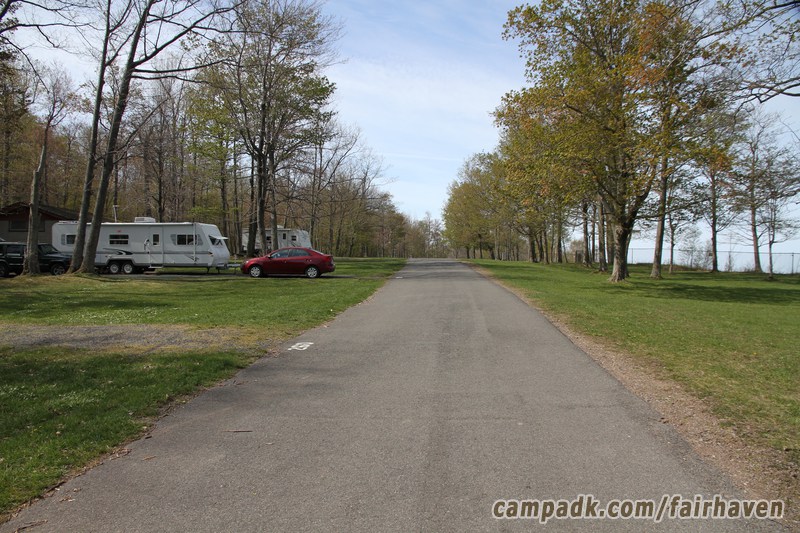 Campsite Photo of Site 261 at Fair Haven Beach State Park, New York - View Down Road From Campsite