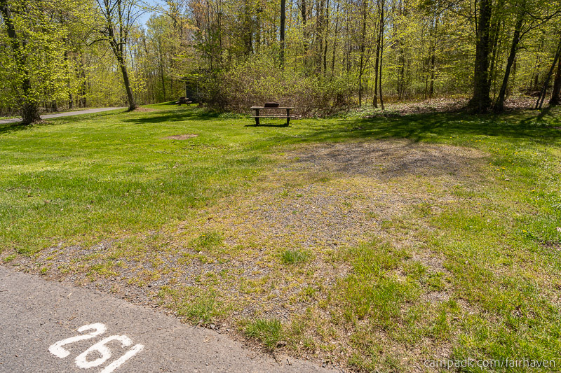 Campsite Photo of Site 261 at Fair Haven Beach State Park, New York - Looking at Site from Road Sign Visible