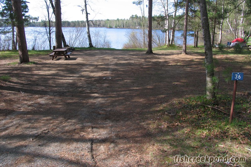 Campsite Photo of Site 46 at Fish Creek Pond Campground, New York - Looking at Site from Road Sign Visible