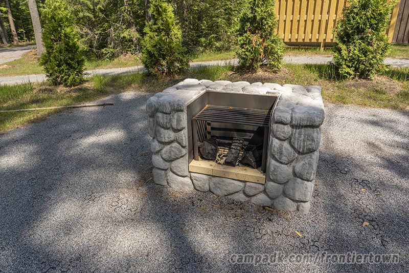 Campsite Photo of Site T65 at Frontier Town Campground, New York - Fireplace View