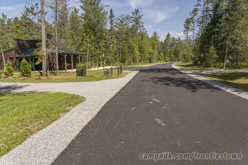 Campsite Photo of Site T65 at Frontier Town Campground, New York - View Down Road from Campsite