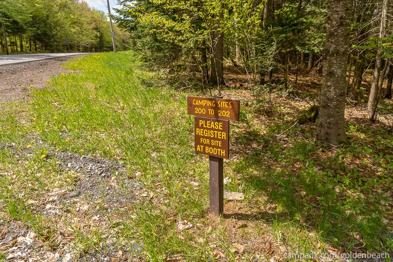 Campsite Photo of Site 200 at Golden Beach Campground, New York - Looking at Site from Road Sign Visible