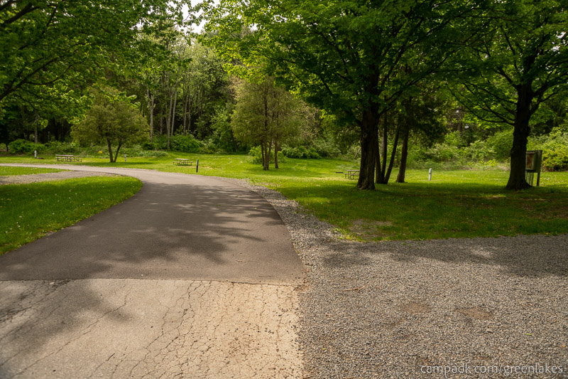 Campsite Photo of Site 116 at Green Lakes State Park, New York - View Down Road from Campsite