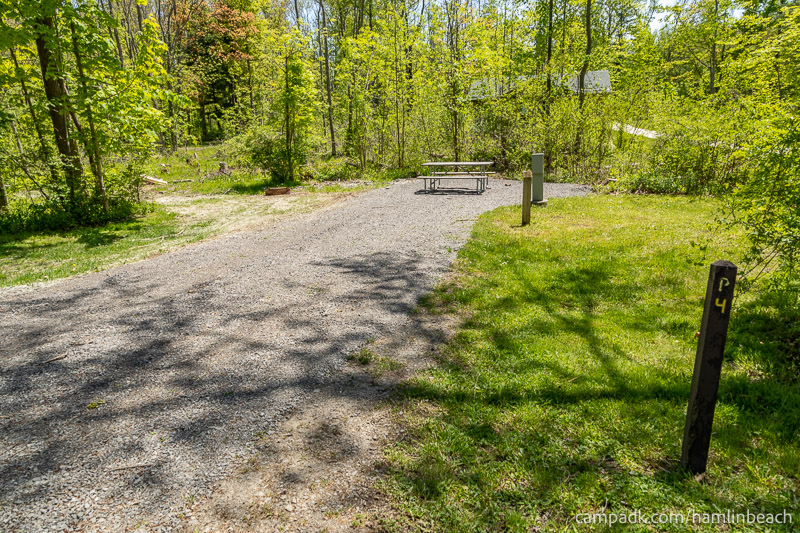 Campsite Photo of Site 4 at Hamlin Beach State Park, New York - Looking at Site from Road Sign Visible
