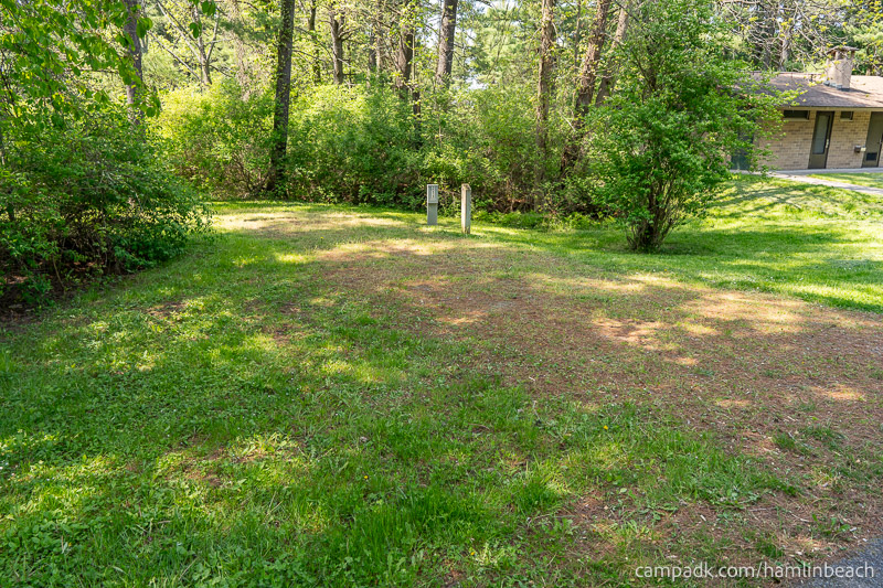 Campsite Photo of Site 216 at Hamlin Beach State Park, New York - Looking at Site from Road Sign Visible