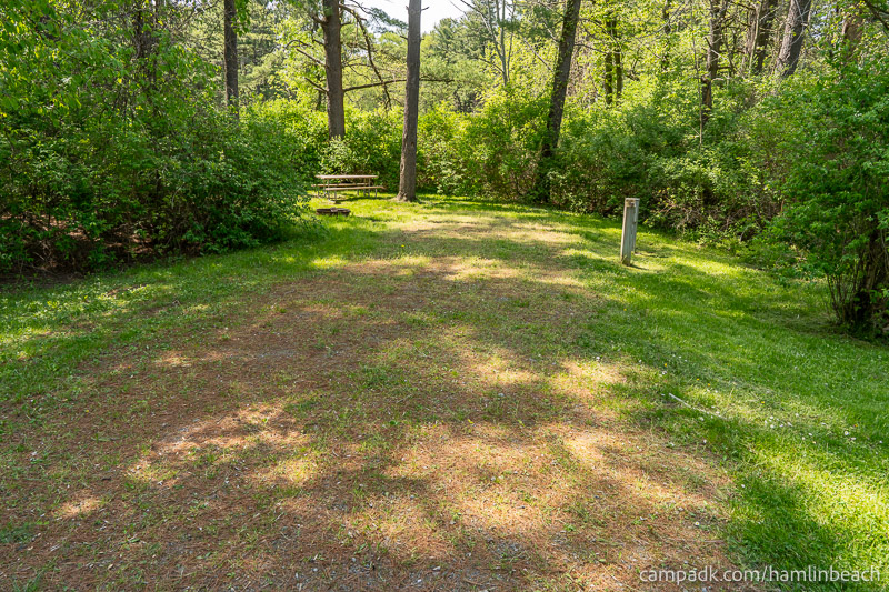 Campsite Photo of Site 216 at Hamlin Beach State Park, New York - Looking at Site from Road Sign Visible