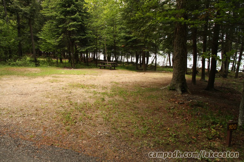 Campsite Photo of Site 100 at Lake Eaton Campground, New York - Looking at Site from Road Sign Visible