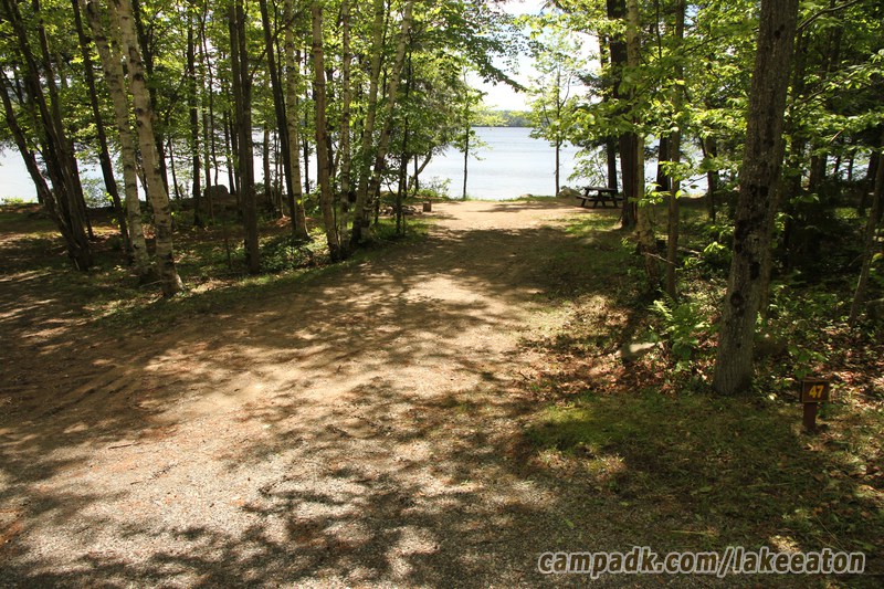Campsite Photo of Site 47 at Lake Eaton Campground, New York - Looking at Site from Road Sign Visible