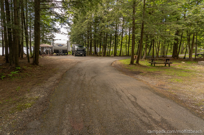 Campsite Photo of Site 118 at Moffitt Beach Campground, New York - View Down Road from Campsite