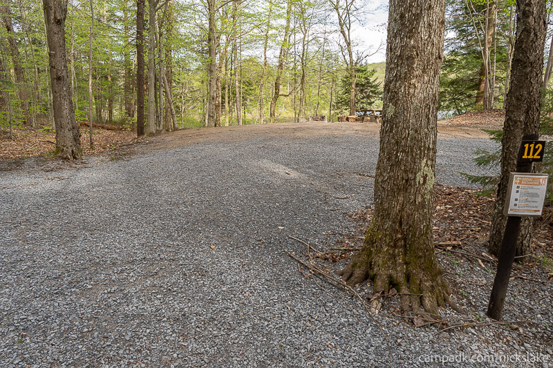 Campsite Photo of Site 112 at Nicks Lake Campground, New York - Looking at Site from Road Sign Visible
