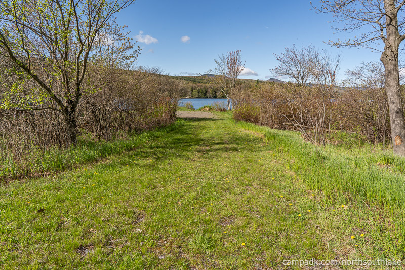 Campsite Photo of Site 150 at North South Lake Campground, New York - Looking at Site from Part Way In