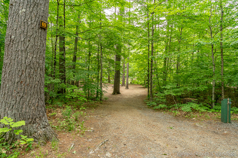 Campsite Photo of Site 69 at Sacandaga Campground, New York - Looking at Site from Road Sign Visible