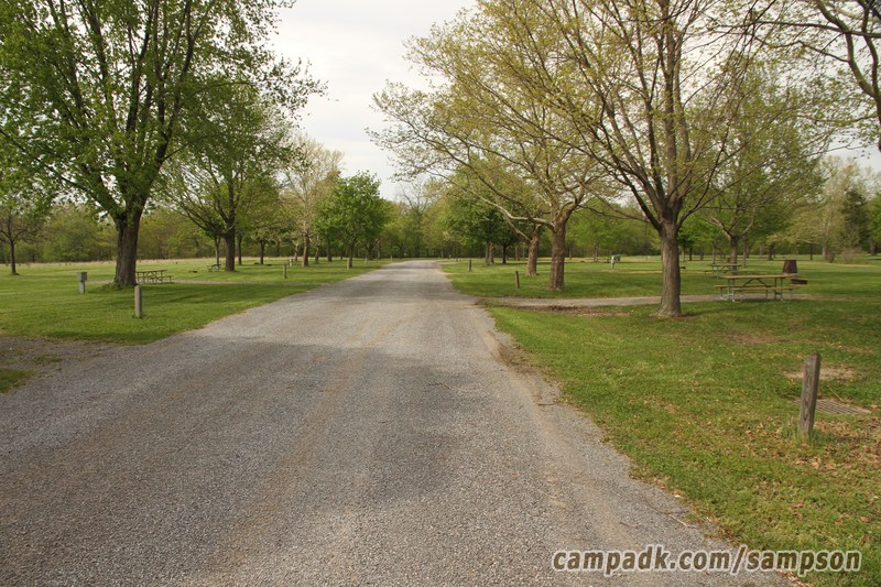Campsite Photo of Site 85 at Sampson State Park, New York - View Down Road from Campsite