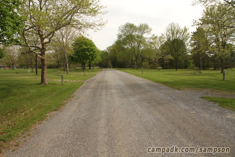 Campsite Photo of Site 85 at Sampson State Park, New York - View Down Road from Campsite