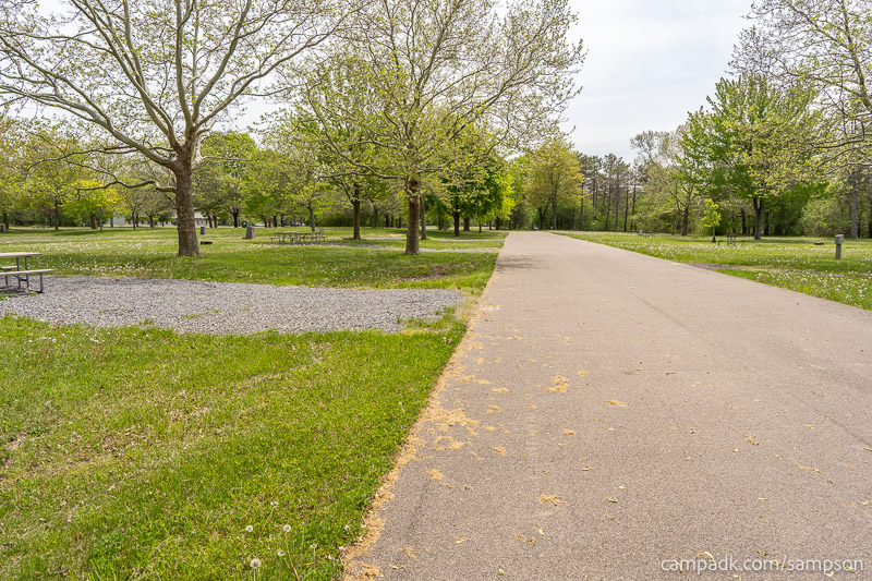 Campsite Photo of Site 85 at Sampson State Park, New York - View Down Road from Campsite