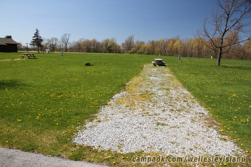 Campsite Photo of Site 19 at Wellesley Island State Park, New York - Looking at Site from Road Sign Visible