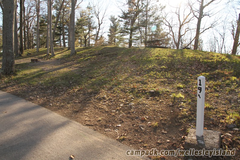Campsite Photo of Site 19 at Wellesley Island State Park, New York - Looking at Site from Road Sign Visible